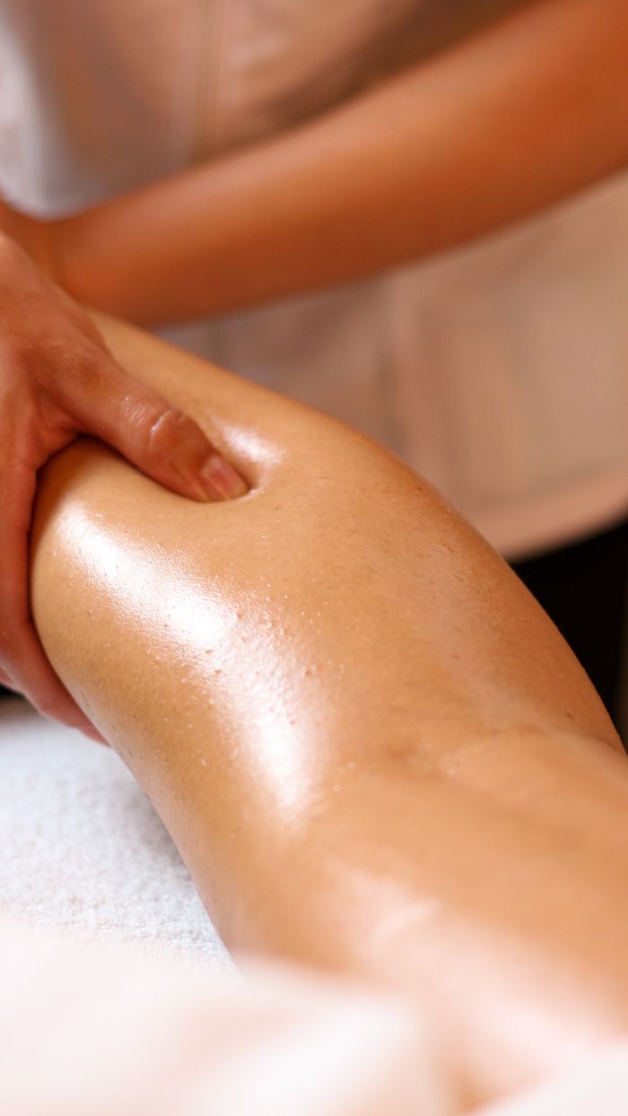 services-09 Close-up of a relaxing leg massage in a spa, highlighting wellness and relaxation.