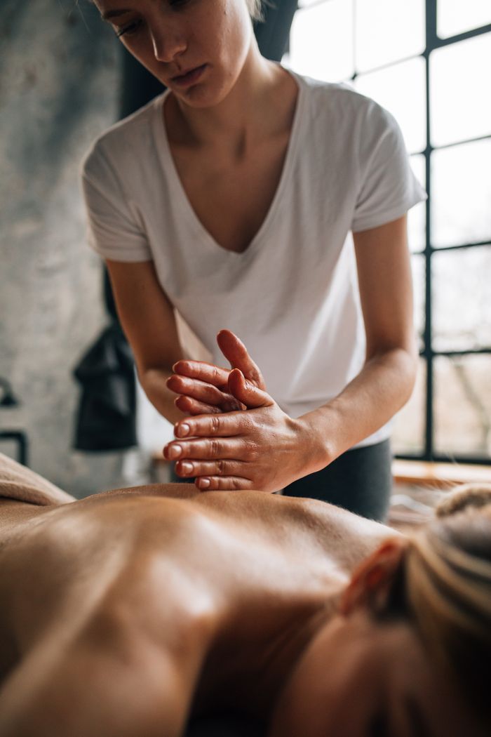 services-05 A soothing massage session in a tranquil indoor setting promoting wellness.